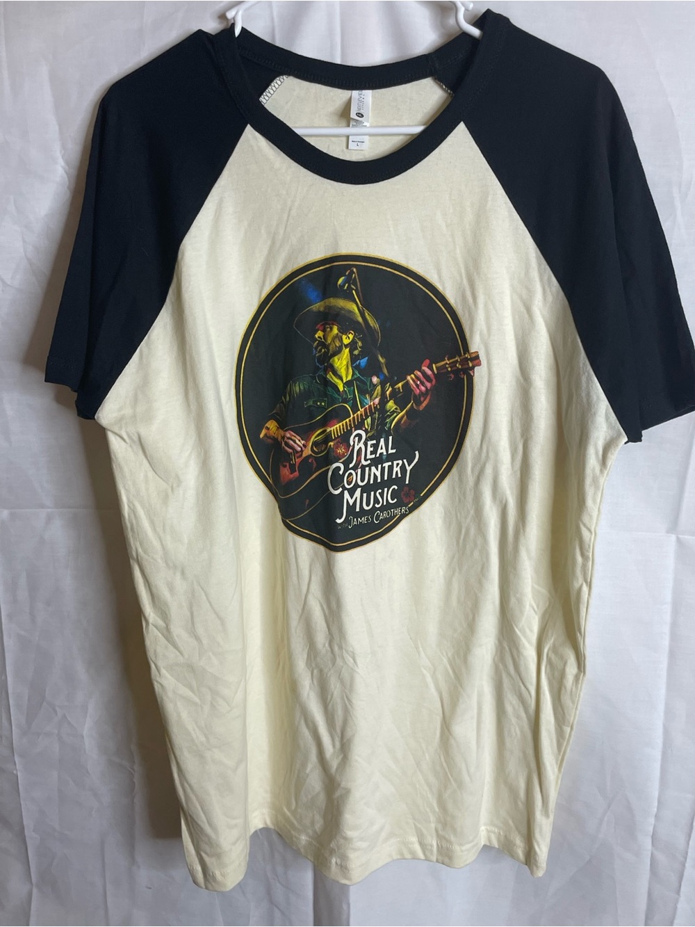 Next Level Apparel Cream and Black Raglan 'Real Country Music' Graphic Tee